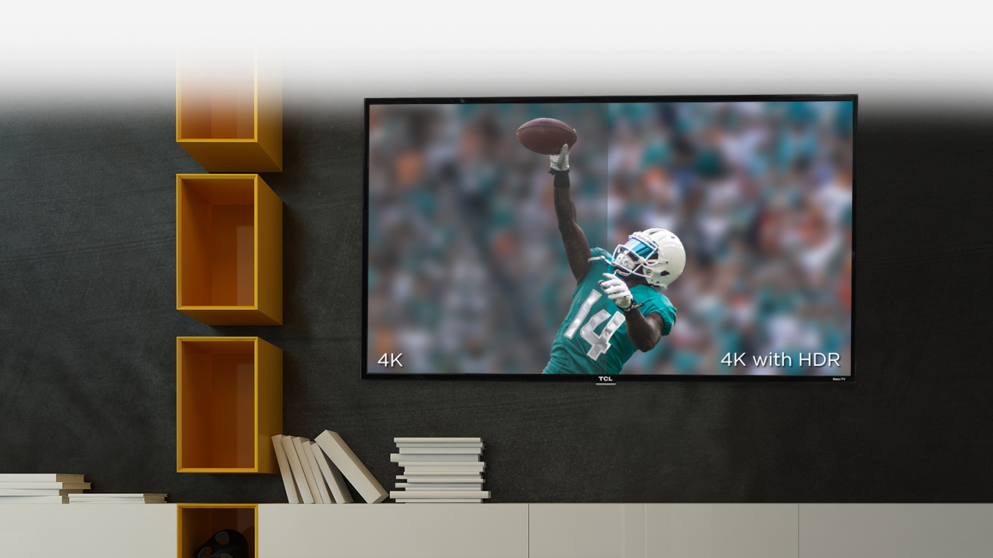 The TCL 55S425 is hung on the wall with a lot of storage compartments on the left