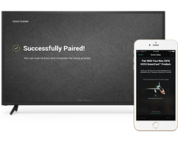 Vizio smart TV showing successfully paired screen with a smartphone in the right forefront