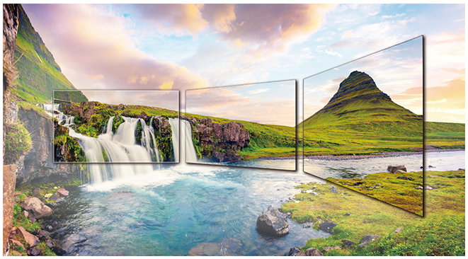 Three LG displays blended into a small waterfall scene in a green plain