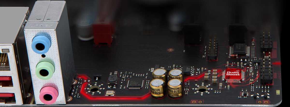 A part of a motherboard, with three audio jacks and four audio capacitors