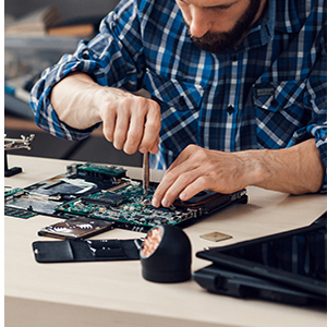a man is fixing a motherboard