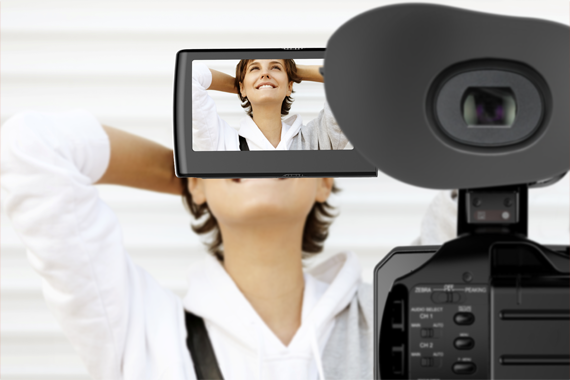 Woman taking selfie with a high-tech camera