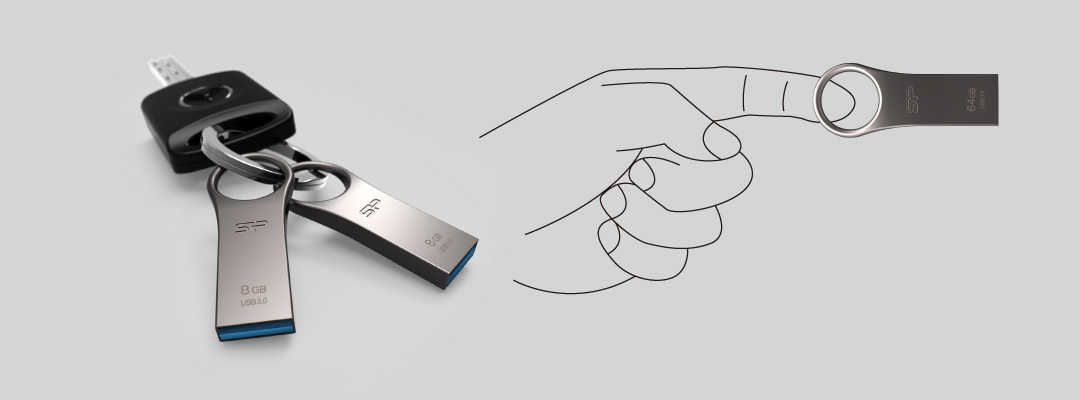 Thumb drives on a key ring with a key fob and a hand diagram showing that the thumb drive is smaller than an index finger