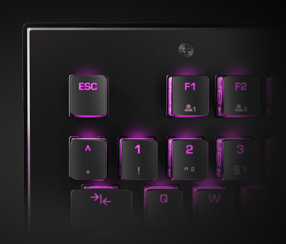 Closeup of the keys around the ESC key in purple lighting on the ROCCAT Vulcan Mechanical Gaming Keyboard