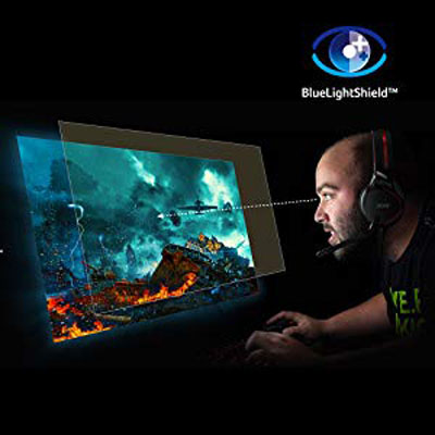 a bald man staring at at a picture on the monitor