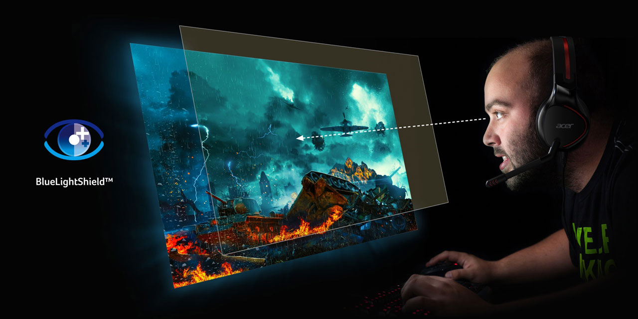   A man playing games in front of the monitor, with a layer of glass floating over the screen indicating blue light filtering 