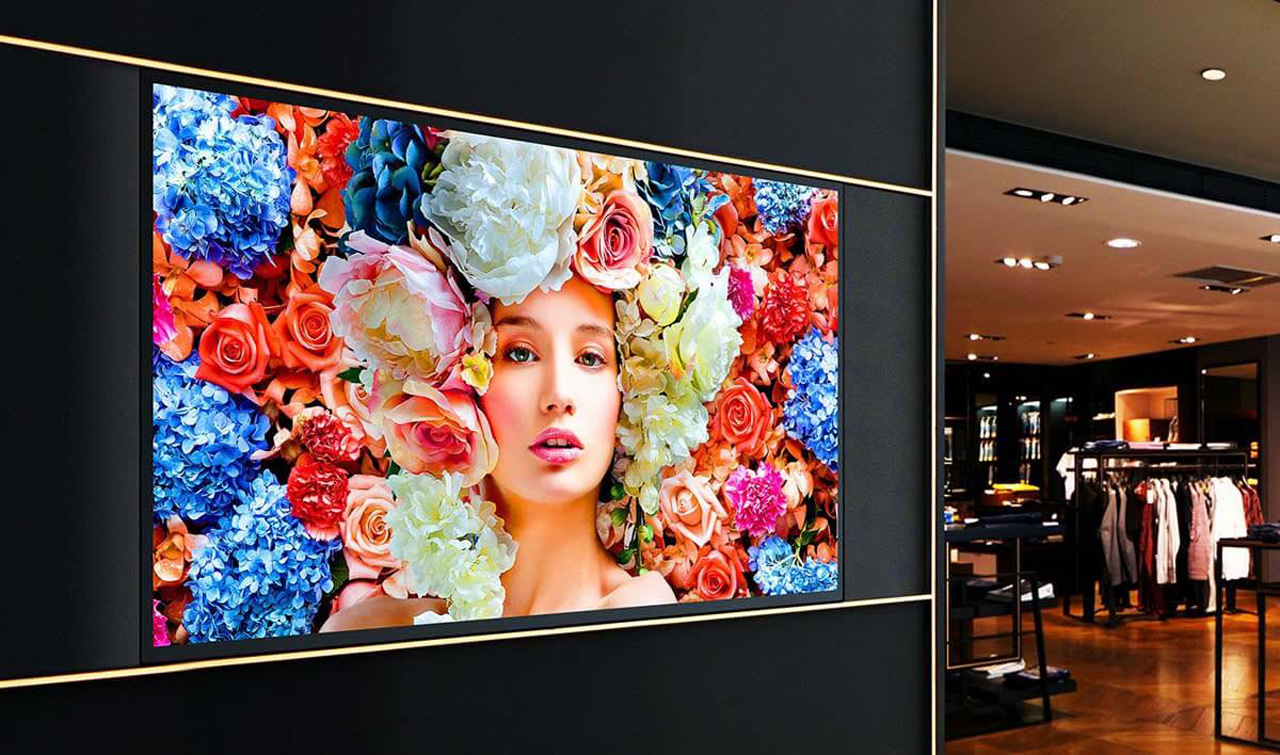Samsung Commercial Display at A Clothing Store Showing a Woman with Flowers as hair and a complete flower background