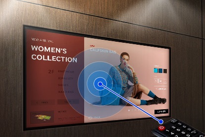 Samsung Display Mounted on a Wall Showing a Women's Collection Clothing Ad