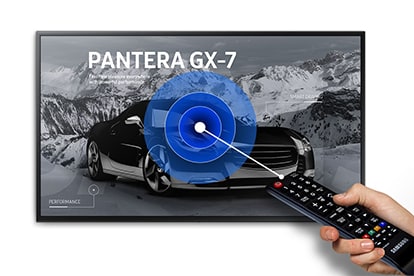 Hand Holding a Remote Point to the Left towards a Samsung Displaying Showing a Car Ad for PANTERA GX-7