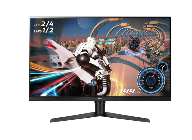 LG 32GK650G-B monitor facing forward showing a video game screenshot of a futuristic motorcycle racing through a sci-fi race track