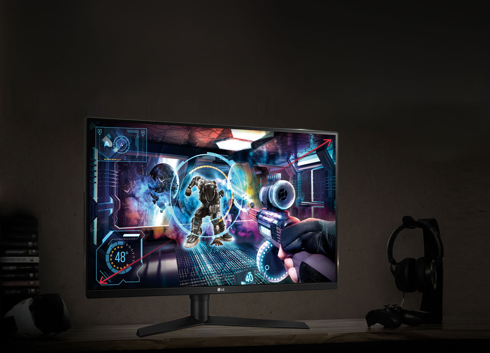 LG 32GK650G-B monitor showing a sci-fi FPS game screenshot on screen. The monitor is on a desk next to over-ear headphones on a stand, a playstation controller, VR headset and game disc cases