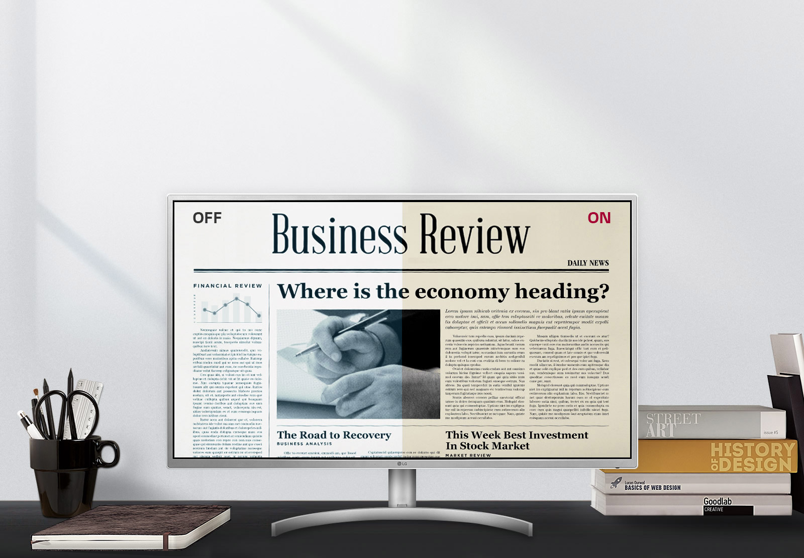 The LG 32QK500-W monitor showing a business review news article in an office setting