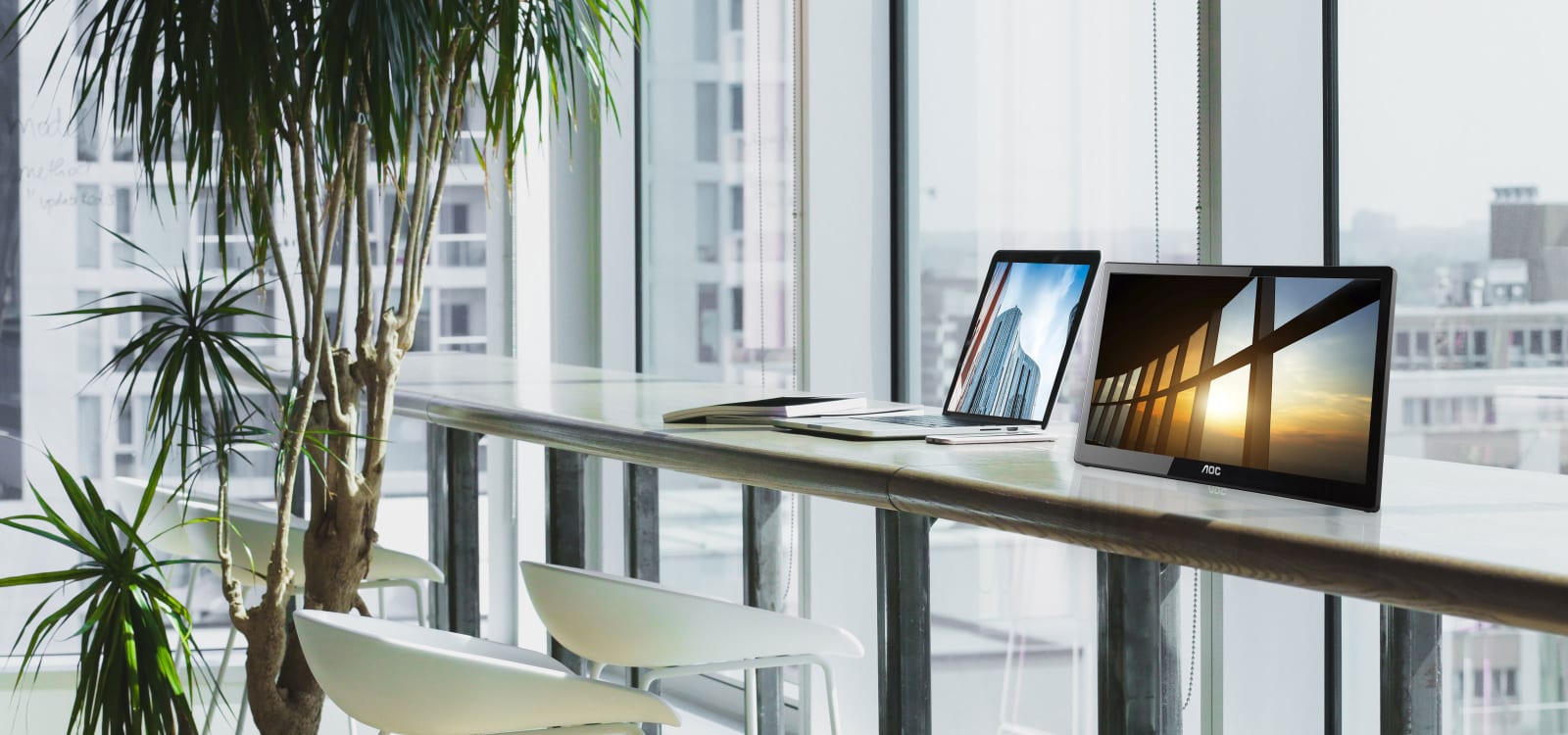 the portable with a sunset image as screen  on a desk