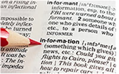 Pencil pointing to the the word information on a dictionary page