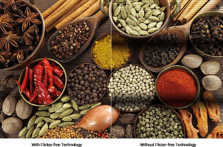 A spread of spices, nuts and seasonings in bowls, half the image is cut in horizontal lines showing a picture quality lacking flicker-free technology