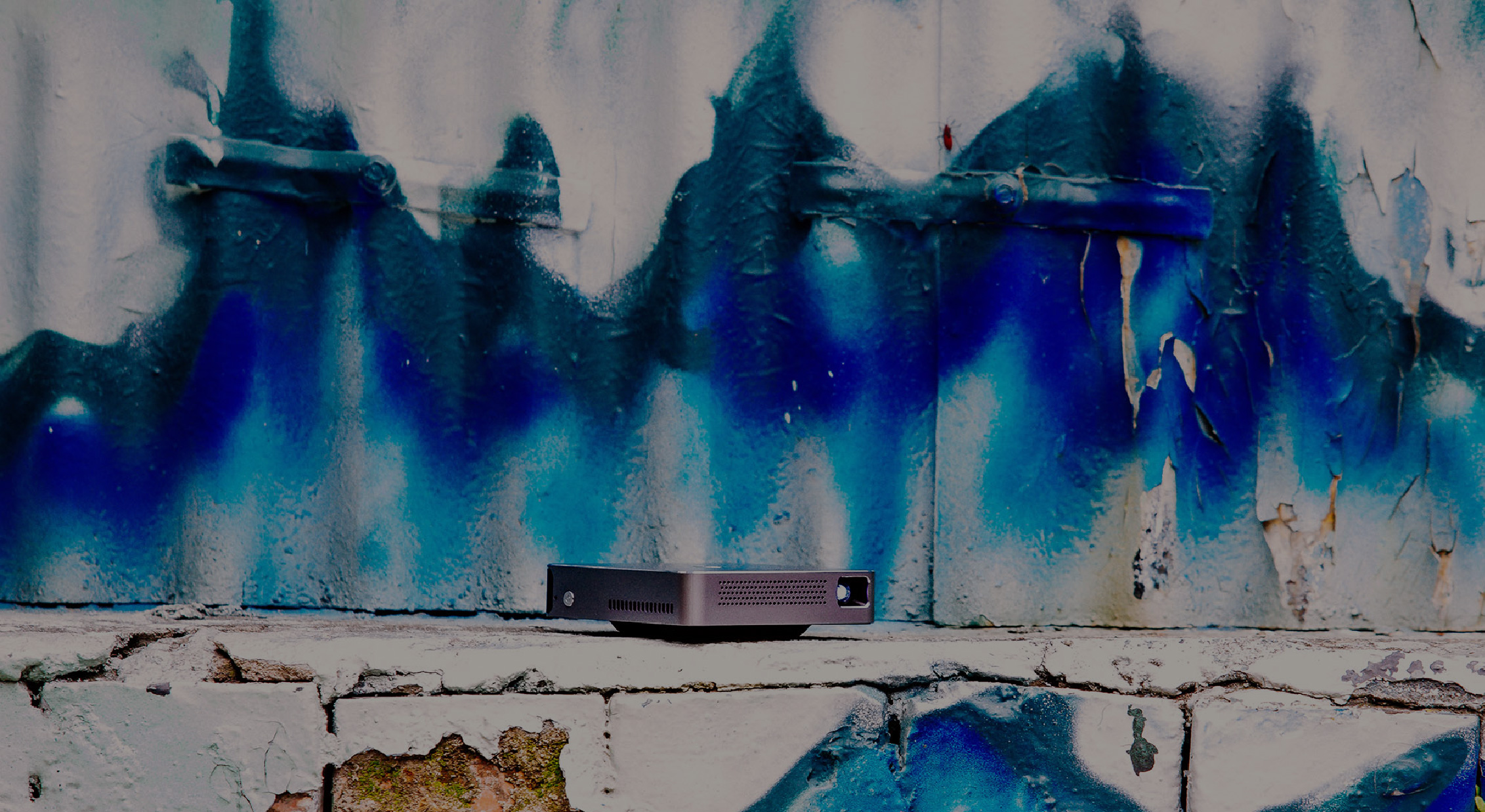HP MP100 Next to a Blue Graffiti Wall