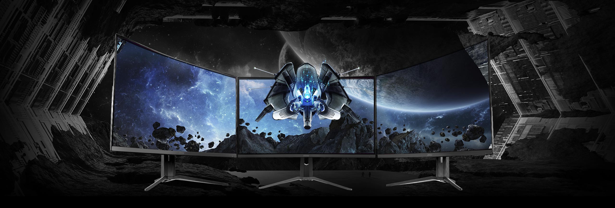  three monitors side-by-side with a space image as screen  