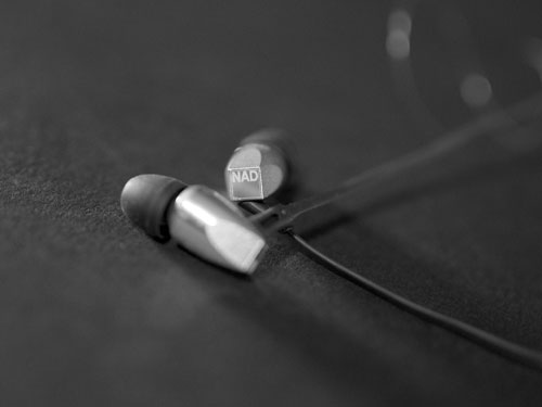 silver HP20 earbuds crossed over each other