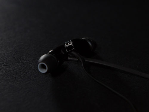 black HP20 earbuds crossed over each other