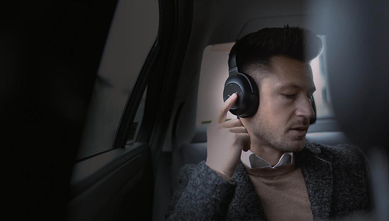 A man with the Beyerdynamic 715517Wireless Headphone enjoys the music