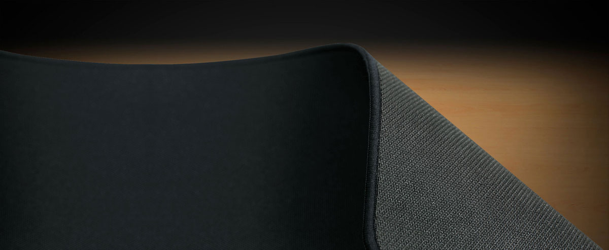 Closeup of the cooler master mp510 gaming mouse pad folding over to show its back side
