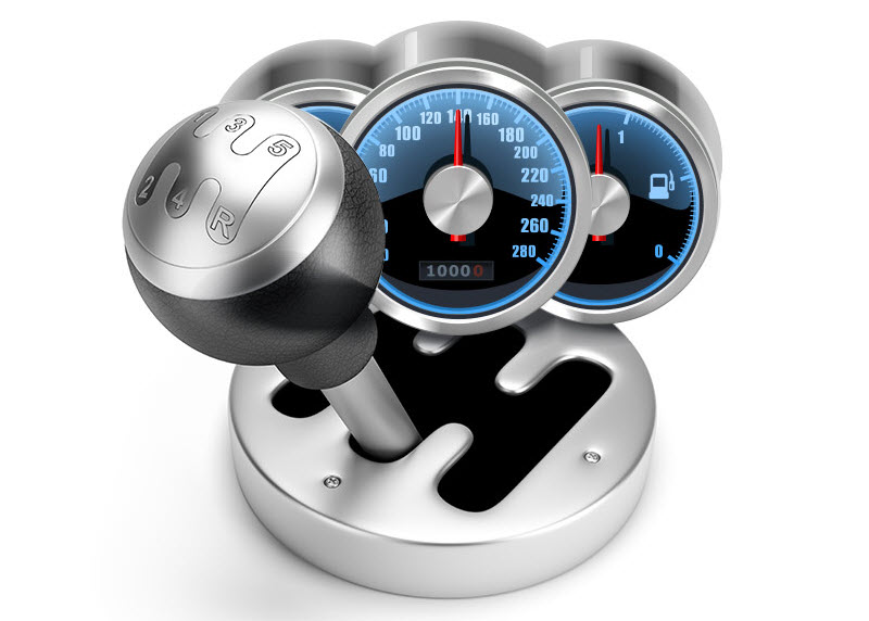 a gear box beside three speedometers
