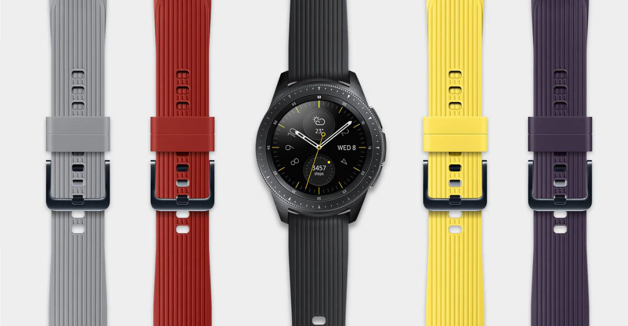 A gray strap and a red strap are on the left side of a black watch whose right side offers a yellow strap and purple strap.