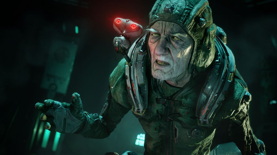 An old man with a pilot's cap and technology around his neck