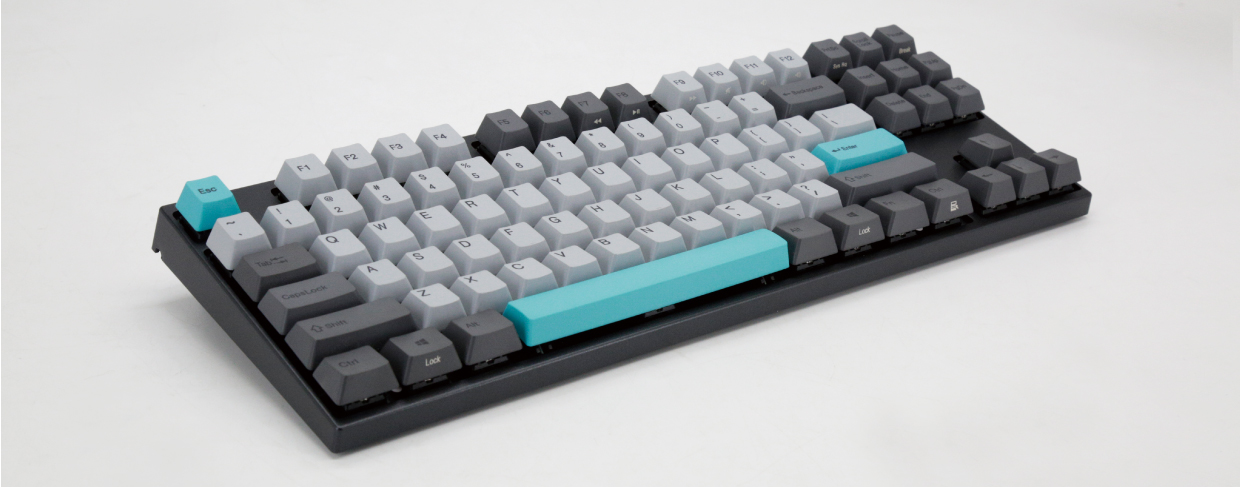  Top angle view of the Varmilo VA87M keyboard, with the keyboard raised at an angle by unfolded feet  