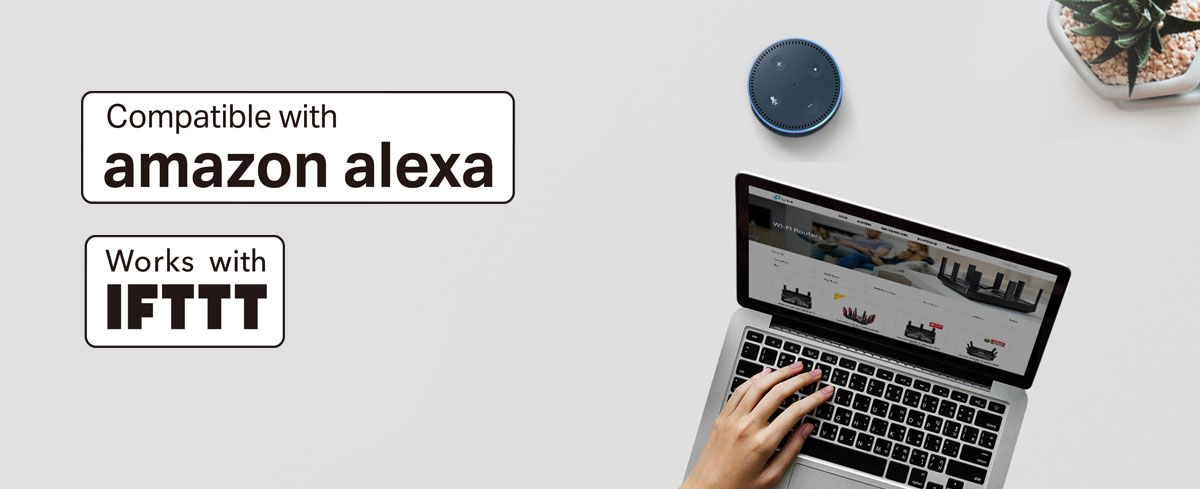 A hand using a laptop next to an Amazon echo device and a potted plant. This banner also has the compatible with amazon alexa and works with IFTTT badges