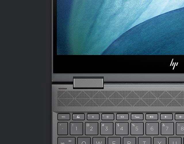 Closeup of an open HP ENVY's hinge, keyboard and screen