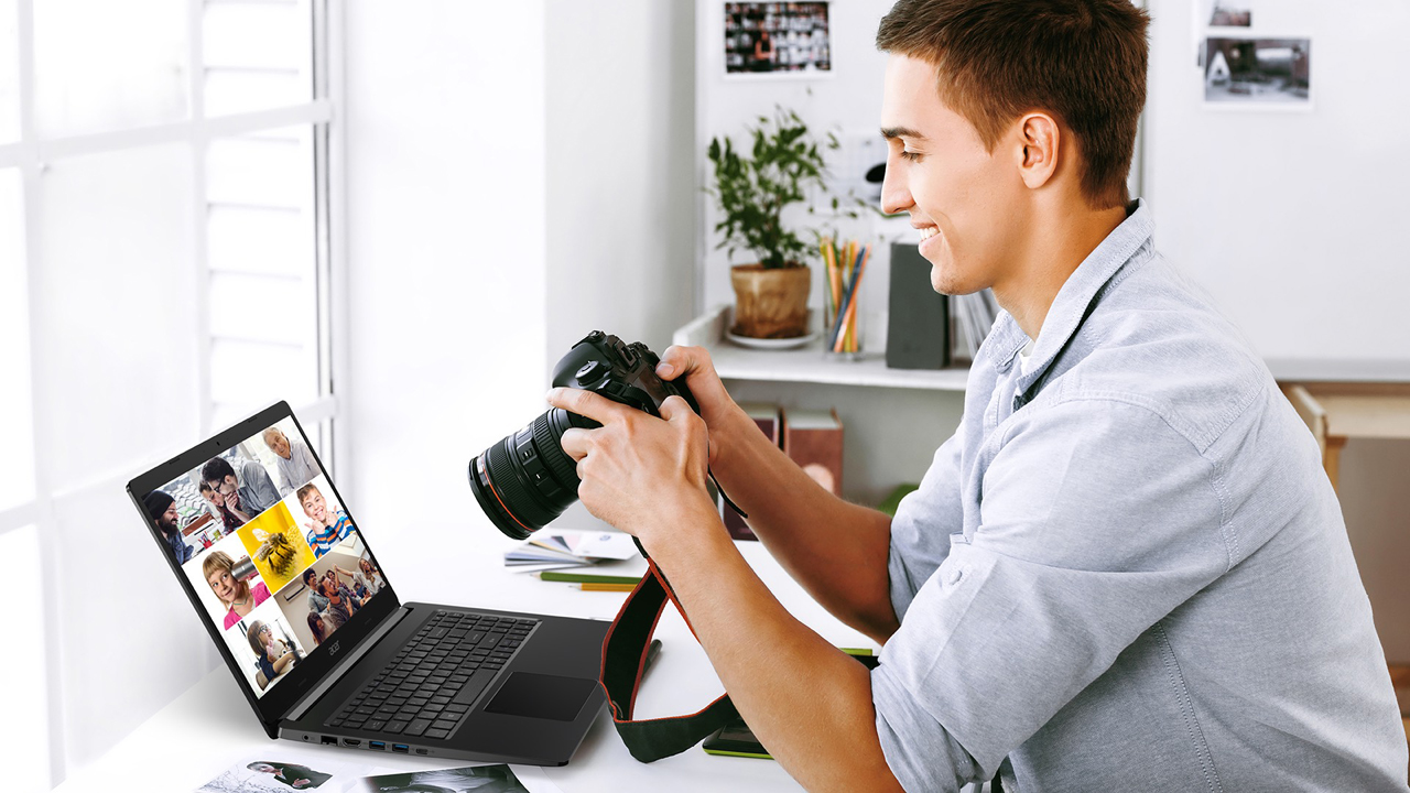 A man is checking photos on his DSLR while many photos are displayed on the monitor of the laptop