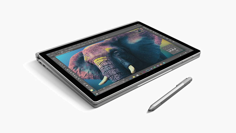 Surface Book in tablet mode beside a Surface Pen
