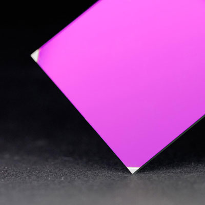  A rectangular piece of glass in magenta color on display  