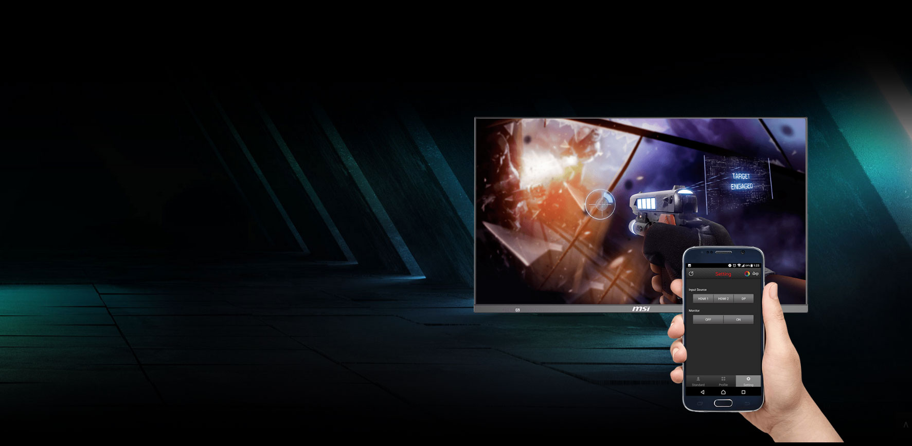 monitor with screenshot of a shooting game and a phone