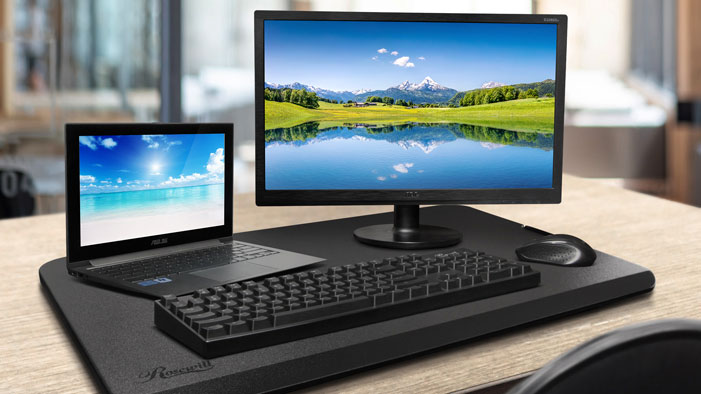 a computer and a laptop on the Desk Riser Monitor Stand to improve it is space saving 