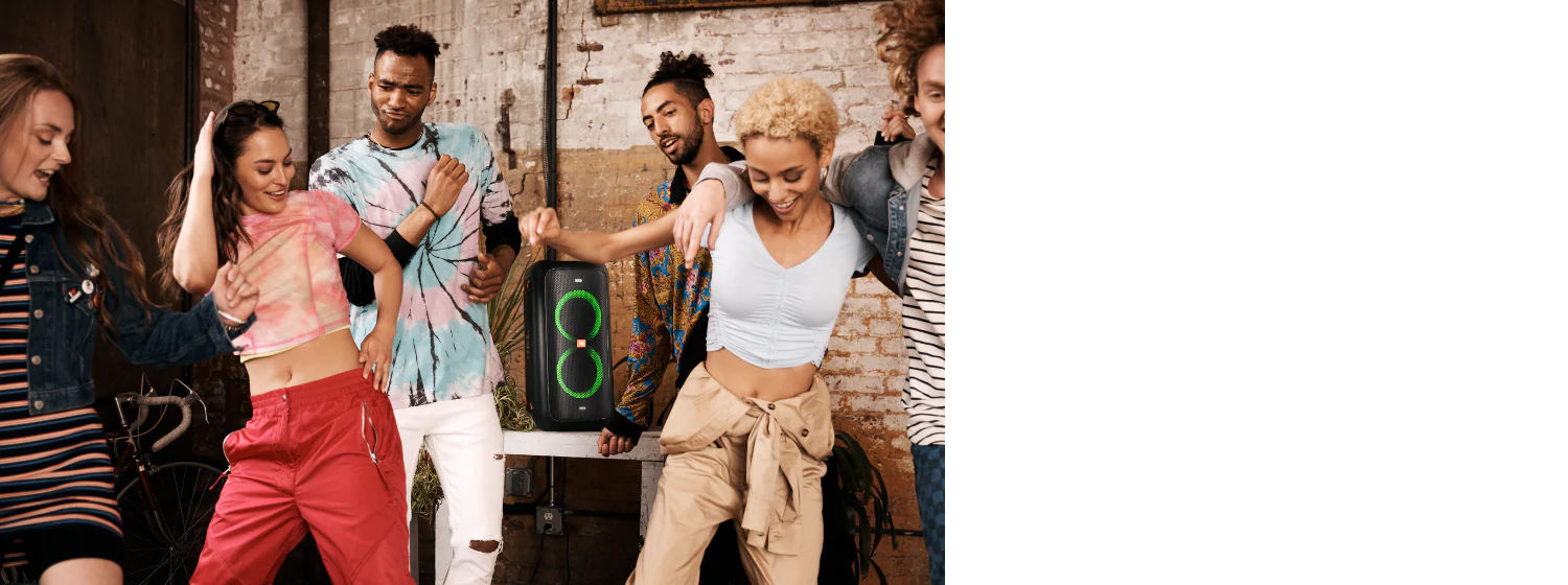 Group of people dancing around JBL PartyBox 100 Powerful Portable Bluetooth Party Speaker