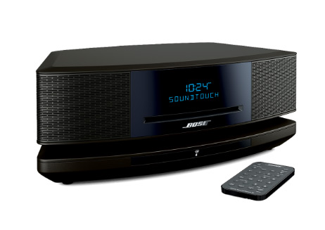 Bose SoundTouch music system IV facing slightly to the right with its remote in fro