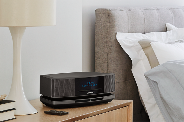 Bose music system IV on a bedroom night stand