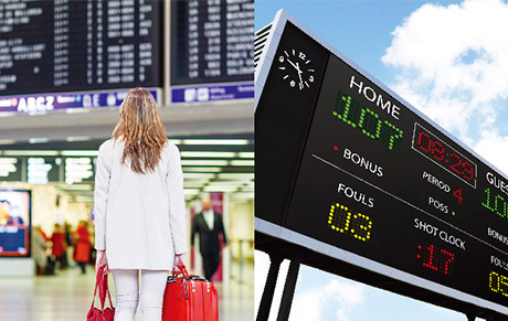 A woman with red luggage in an airport terminal