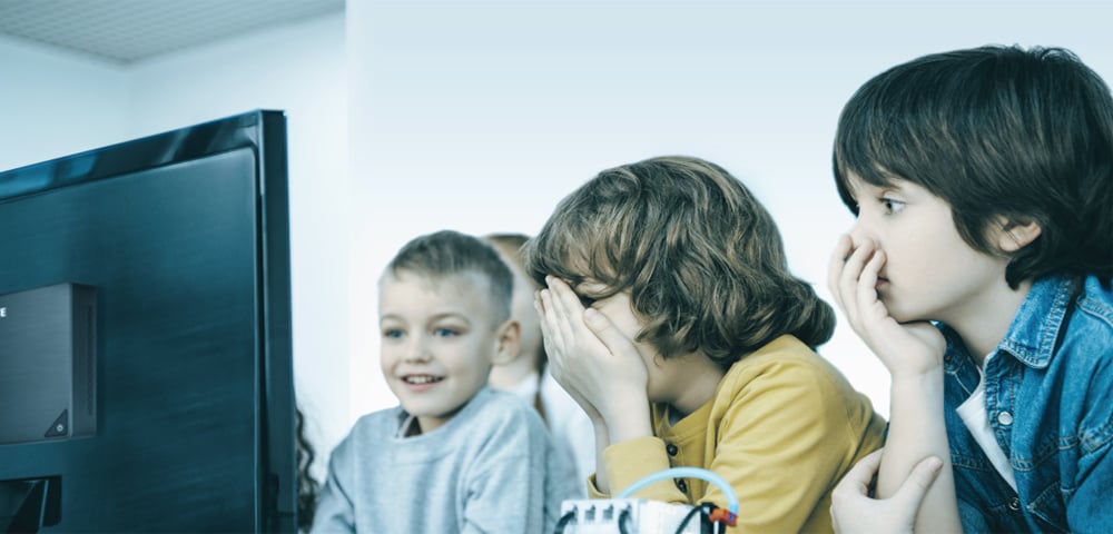 some children are in front of  computer