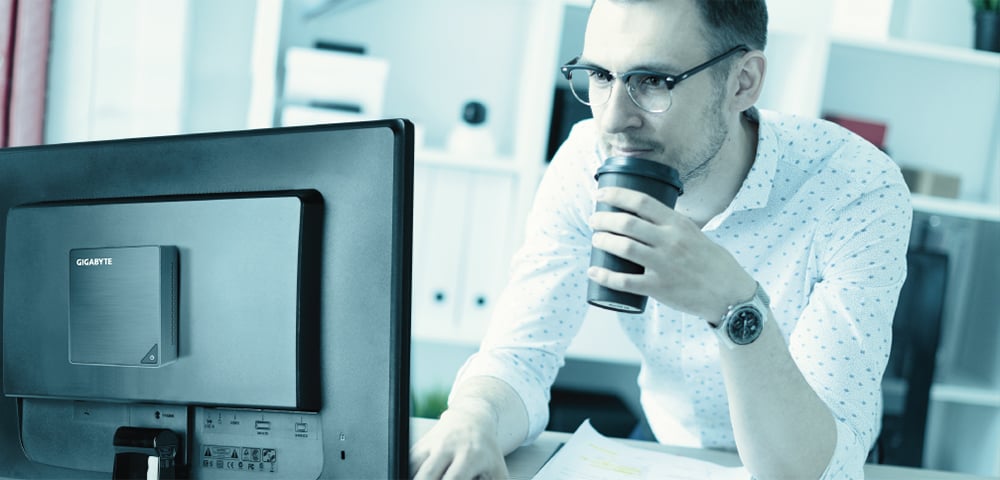 a man is working in front of a computer