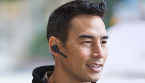 Closeup of a man with the bluetooth headset