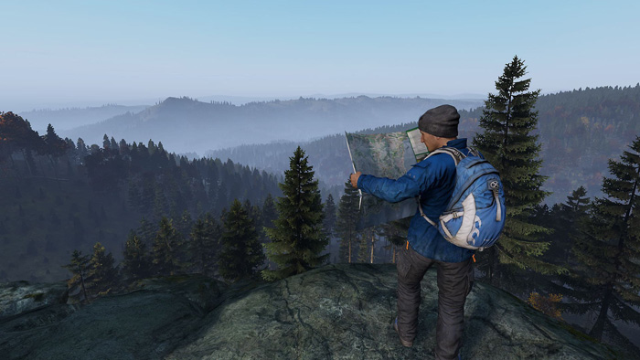 screenshots3 for DayZ showing a hiker at a summit, looking at a map