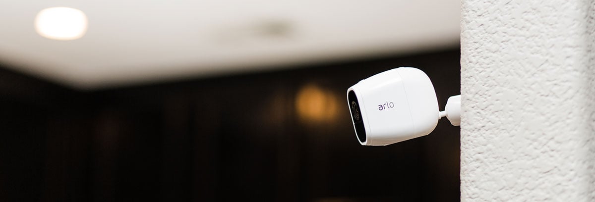 Arlo Pro 2 Installed on a White Wall Outside