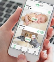  An iPhone in hands, with screen showing live feed of the camera  