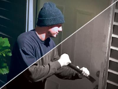 Split image showing a a burglar attempting to break open a door at night, half of the image is black and white and the other half is colored