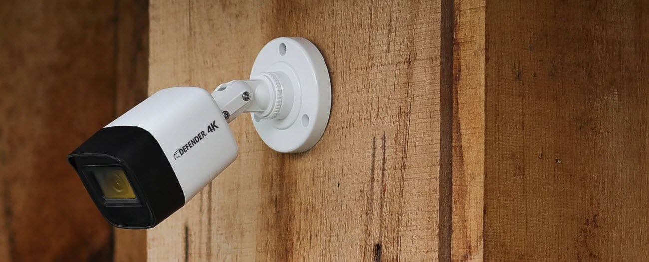Defender 4K security camera hangled on the wall