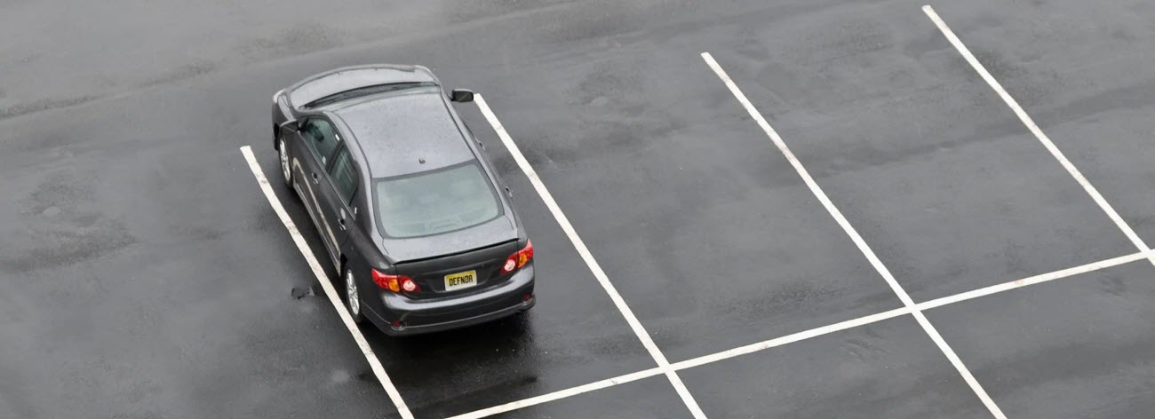 a black car parked in the garage