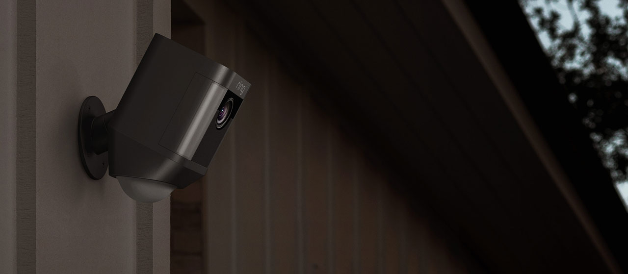  Closeup of a black Spotlight Cam Battery on the wall 